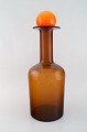 Otto Brauer for 
Holmegaard. 
Large vase / 
bottle in light 
brown art glass 
with orange 
ball. ...