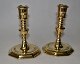 Pair of Danish baroque candlesticks in brass, 18th century. With 8 angular feet and profiled ...