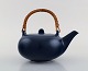 Eva 
Stæhr-Nielsen 
for Saxbo. 
Teapot in 
glazed ceramics 
with handle in 
wicker. 
Beautiful glaze 
in ...
