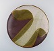 European studio ceramist. Unique dish in glazed ceramics. Dated 1985. Beautiful 
glaze in gray and olive green tones.
