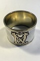 Silver Napkin 
Ring gilt 
inside, 
Monogram, No 
Hallmarks 
Inside diam 5 
cm(2 in)Weight 
38.5 gr/ 1.36 
oz