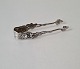 Sugar tongs in 
silver
Stamped: 830 - 
AG
Length 9.7 cm.