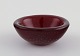 Small Murano bowl in red mouth blown art glass with inlaid air bubbles. 1960