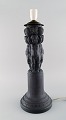 Hjorth, 
Denmark. Large 
lamp made of 
black 
terracotta 
decorated with 
boys and 
bunches of 
grapes. ...
