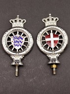 A pair of KDAK emblems