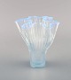 Arthur Percy for Gullaskruf. Veckla vase in light blue mouth blown art glass. 
Wavy shape. Sweden, mid-20th century.
