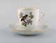 Royal Copenhagen "Spring" coffee cup with saucer in porcelain with motifs of 
birds and foliage. 1980