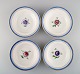 Four antique 
Royal 
Copenhagen deep 
plates in 
hand-painted 
porcelain with 
flowers and 
blue edge ...