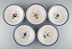 Five antique 
Royal 
Copenhagen deep 
plates in 
hand-painted 
porcelain with 
flowers and 
blue border ...
