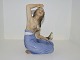 Dahl Jensen figurine, girl from Hawaii with bird.The factory mark tells, that this was ...
