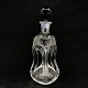 Height 26 cm.
the decanter 
have something 
withe on the 
one "shoulder".
Kluk flask in 
clear ...