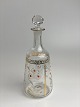 Fine, small 
enamel-painted 
carafe with 
daisy motif in 
white and gold. 
The carafe has 
a beautiful ...