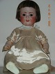 German doll, 
with open 
mouth, weighted 
brown glass 
eyes, dark real 
hair wig, 
composition 
body. ...