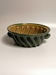 19th century 
green glazed 
pudding shape 
Height 10.5cm 
Diameter 27cm. 
Province Robert 
Jacobsen ...