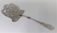 Tang. Silver 
cutlery (830). 
Serving spade 
for asparagus. 
Length 28 cm. 
Produced 1909.
