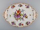 Large Dresden serving dish in hand-painted porcelain with floral motifs and gold 
decoration. Early 20th century.

