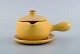 Vicke 
Lindstrand for 
Uppsala Ekeby. 
Sauce boat on 
saucer in 
glazed 
stoneware. 
Beautiful 
yellow ...