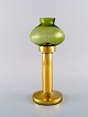 HANS-AGNE JAKOBSSON for A / B MARKARYD. Oil lamps in brass and green art glass. 
1960 / 70
