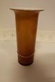 Vase from Holmegaard / Kastrup Glasværk, Denmark
From the Regnbue Serien (Rainbow Serie)
The beautiful caramel-colour outside with opal white hvidt glass inside
Design: Michael Bang i 1970
H: 17cm
In a good condition