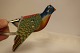 For the 
collectors:
Parrot / 
"dickybird", 
which flapps 
with its wings 
and chirps
Made of ...