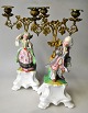 Pair of French candelabra of porcelain and bronze, 19th century. Hand-painted bisquit porcelain. ...