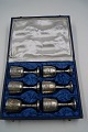 6 silver plated drinking cups on round base. In blue box with velvet.The cups are in a good, ...