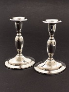 A pair of 830 silver candlesticks 14.5 cm. on oval foot