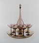 Simon Gate for 
Orrefors. Art 
deco liqueur 
set in smoky 
mouth-blown art 
glass. Seven 
glasses, ...