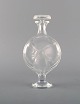 Lalique flacon 
in clear and 
frosted art 
glass. 1980s.
In excellent 
condition.
Incised ...