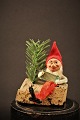 Nice little old 
man playing elf 
sitting on tree 
stump ,  made 
of pipe 
cleaners, face 
painted ...