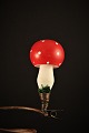 Old Christmas 
tree 
decorations in 
the form of a 
mushroom with a 
red hat and 
white dots in 
glass. ...