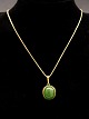 8 carat gold 
necklace 46 cm. 
and pendant 1.9 
x 1.8 cm. with 
jade from 
jeweler Poul 
Ibsen ...