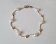 Bernhard Hertz 
beautiful and 
feminine 
vintage 
bracelet in 14 
kt gold with 6 
pearls and 6 
...