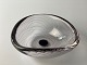 Bowl of clear 
glass with 
purple threads. 
Vicke 
Lindstrand for 
the Swedish 
glassworks 
Kosta. ...