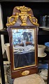 Beautiful 1800s 
mirror in wood 
with gilding. 
Dimensions 36 
x 74 cm.