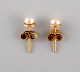 Swedish jeweler. A pair of classic ear studs in 18 carat gold adorned with 
cultured pearls. Mid-20th century.
