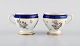 Sevres, France. Two antique cream cups in hand-painted porcelain with flowers 
and gold decoration. 19th century.
