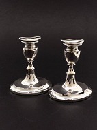 A pair of 830 silver candlesticks 12.5 cm. on oval foot
