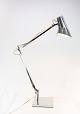Table lamp of stainless steel and of italian design by Flos. The lamp is in great vintage ...