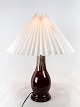 Tablelamp with 
dark red glaze 
from Michael 
Andersen's 
ceramic factory 
on Bornholm. 
The shade is 
...