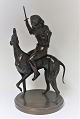 Bronze figure. 
Boy sitting on 
greyhound. 
Height 45 cm.