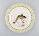 Royal Copenhagen fish plate with green edge, gold decoration and fish motif. 
Model 919/1710.
