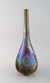 Fransk keramiker. Antik smalhalset vase i glaseret keramik. Smuk lustreglasur. 
Tidligt 1900-tallet.
