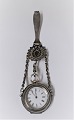 Silver ladies pocket watch. (800) with nice silver watch holder. The clock works. Produced ...