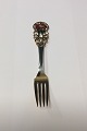 Anton Michelsen 
Christmas Spoon 
1925 Gildedd 
Sterling Silver 
with Enamel
The Poinsettia 
is a ...