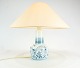 Table lamp in 
blue painted 
porcelain by 
Bing And 
Grøndahl. The 
shade is hand 
folded and hand 
...