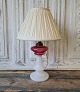 Beautiful 1800s 
opaline lamp 
with oil 
container in 
pink / 
raspberry 
colored glass. 
Remodeled for 
...