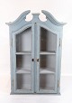Tall grey painted hanging glass cabinet in gustavian style from around 1820. The cabinet is in ...