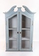 Tall grey 
painted hanging 
glass cabinet 
in gustavian 
style from 
around 1820. 
The cabinet is 
in ...