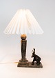 Table lamp made 
of marble with 
decorativ 
elephant. The 
shade is 
handpainted and 
handfolded of 
paper.